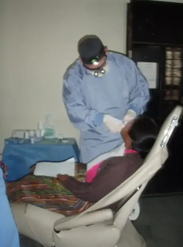 Dr. Copeland on a service trip to Latin America helping to remove teeth on patients in need