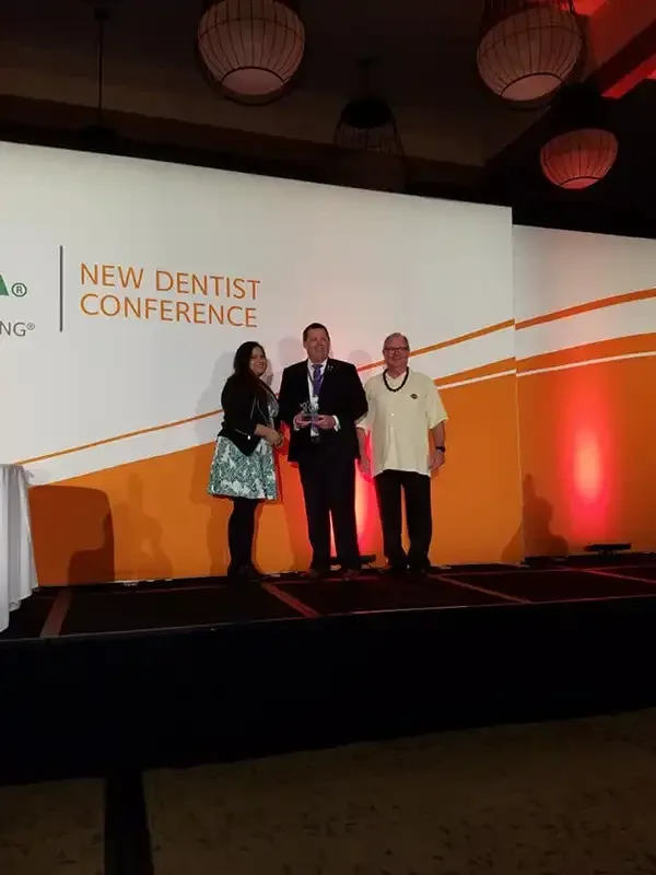Dr. Copeland accepting an award at the New Dentist Conference